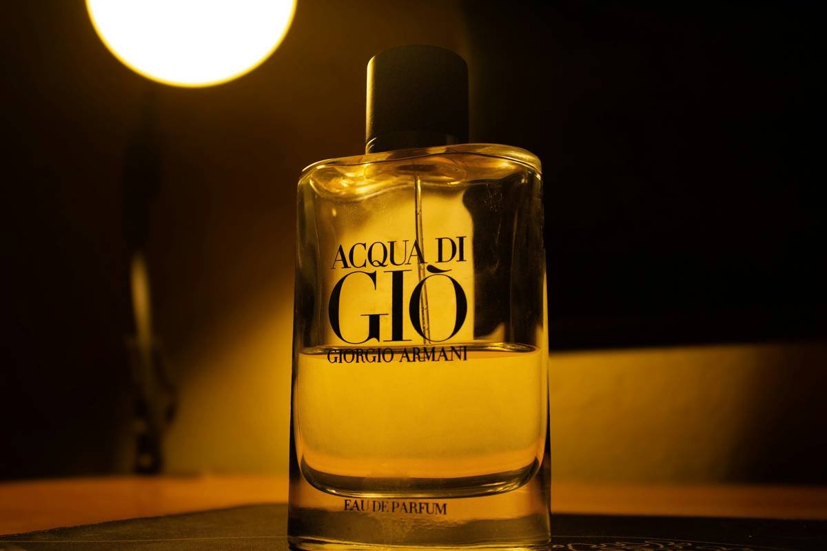 Man applying single spray of cologne to wrist for maximum how long will 50ml cologne last efficiency