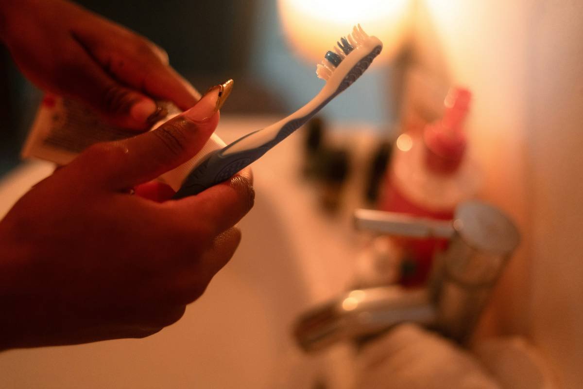 man applying men cologne spray tips correctly on wrist pulse point